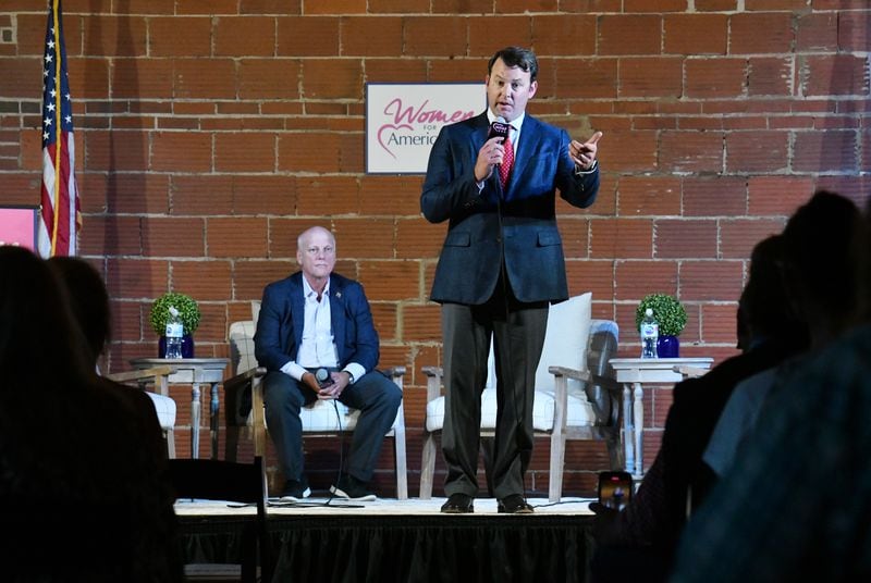 State Senator Burt Jones speaks as State Senator Brandon Beach looks on during "2020 Election Integrity Townhall" meeting at The Lewis Loft in Rome on Tuesday, July 13, 2021. (Hyosub Shin / Hyosub.Shin@ajc.com)