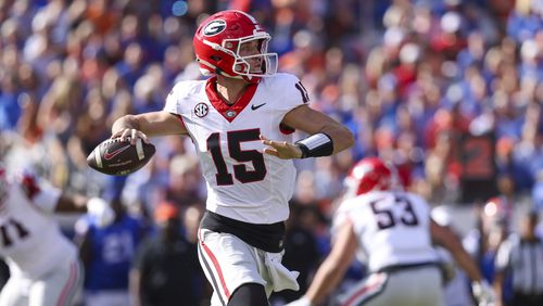 Georgia quarterback Carson Beck (15) attempts a pass during the first quarter against Florida at EverBank Stadium, Saturday, October 27, 2023, in Jacksonville, Fl. (Jason Getz / Jason.Getz@ajc.com)