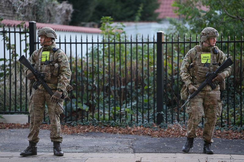 Military police officers stand guard as police investigate two explosions near the Israeli embassy in Copenhagen, Wednesday, Oct. 2, 2024. (Emil Nicolai Helms/Ritzau Scanpix via AP)