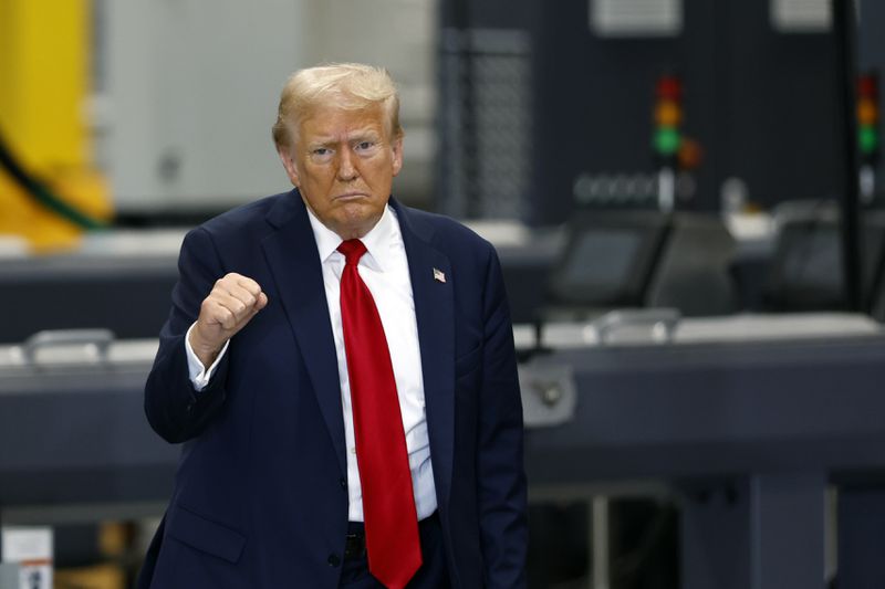 Republican presidential nominee former President Donald Trump gestures as he leaves a manufacturing plant after speaking in Mint Hill, N.C., Wednesday, Sept. 25, 2024. (AP Photo/Nell Redmond)