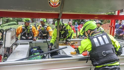 An Atlanta fire rescue crew on Friday morning in Atlanta. (John Spink/The Atlanta Journal-Constitution)