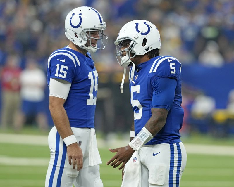 Indianapolis Colts quarterback Anthony Richardson (5) walks off the field as he is replaced by Joe Flacco (15), after being injured during the first half of an NFL football game against the Pittsburgh Steelers, Sunday, Sept. 29, 2024, in Indianapolis. (AP Photo/Darron Cummings)