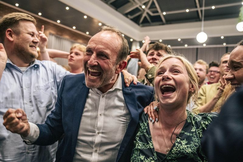 Sigrid Friis and Martin Lidegaard, of the Social Liberal Party, celebrate at an election party at Green Power Denmark in Copenhagen, Sunday, June 9, 2024. (Thomas Traasdahl/Ritzau Scanpix via AP)