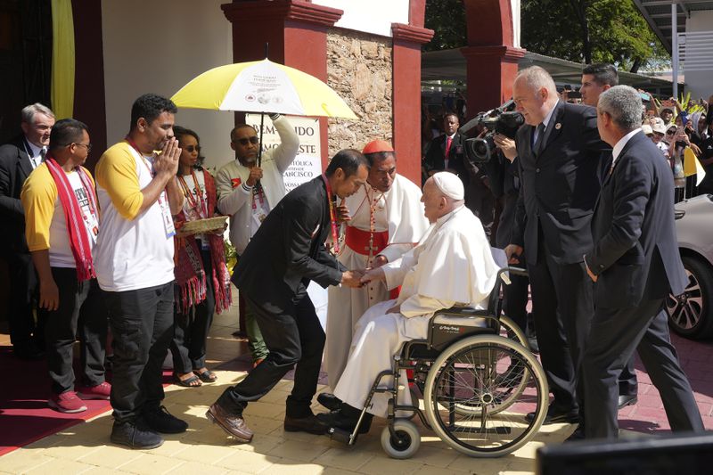 Pope Francis is welcomed during the meeting with young people in Centro de Convencoes in Dili, East Timor, Wednesday, Sept. 11, 2024. (AP Photo/Firdia Lisnawati)