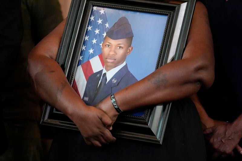 FILE - Chantemekki Fortson, mother of slain Roger Fortson, a U.S. Air Force senior airman, holds a photo of her son during a news conference with attorney Ben Crump on Monday, June 3, 2024, in Atlanta. (AP Photo/Brynn Anderson, File)