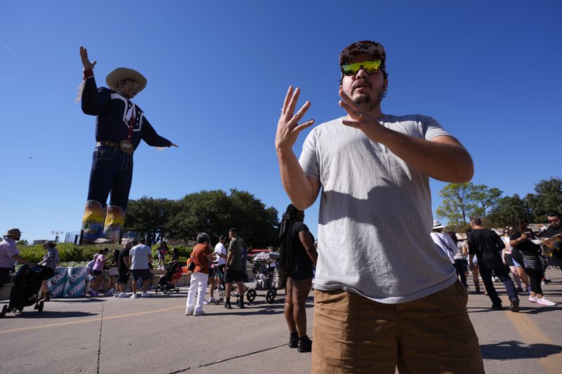 Corey McCarrell responds to a reporter's questions regarding the ban on guns at the State Fair of Texas in Dallas, on Friday, Sept. 27, 2024. (AP Photo/Tony Gutierrez)