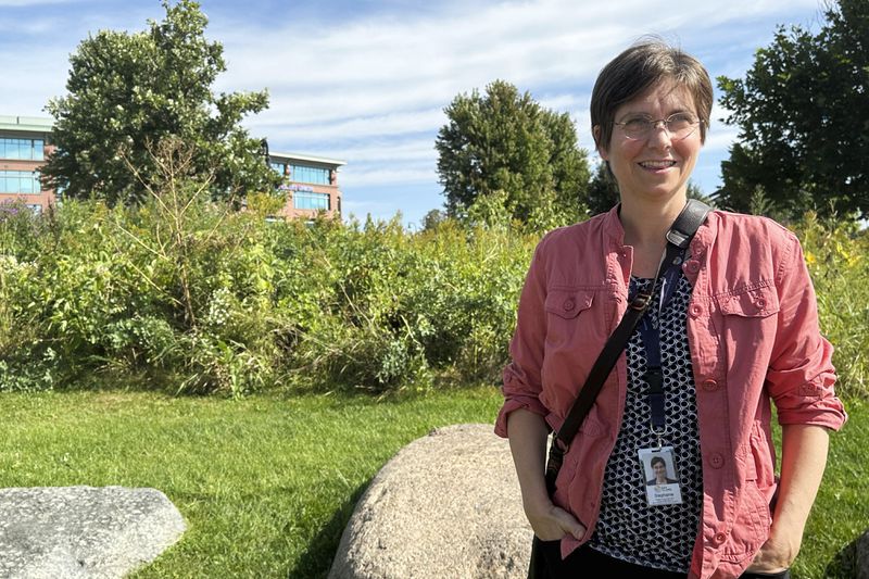 Stephanie Hirsch, city manager for Eau Claire, Wis., who supported the resettlement of refugees in the western Wisconsin city despite opposition from Republicans, poses in a downtown park ahead of a campaign visit from vice presidential candidate JD Vance Tuesday, Sept. 17, 2024. (AP Photo/Scott Bauer)