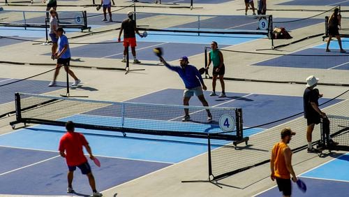 People practice pickleball on the courts of CityPickle at Central Park's Wollman Rink, Saturday, Aug. 24, 2024, in New York. (AP Photo/Eduardo Munoz Alvarez)