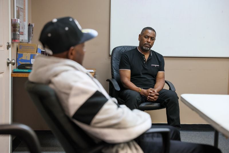 Greg Smith, director of Here’s to Life, was among those who worked to distribute information on monkeypox vaccines to Atlanta's LGBTQ community. He listens during a group counseling session in Atlanta on Wednesday, October 5, 2022.   (Arvin Temkar / arvin.temkar@ajc.com)