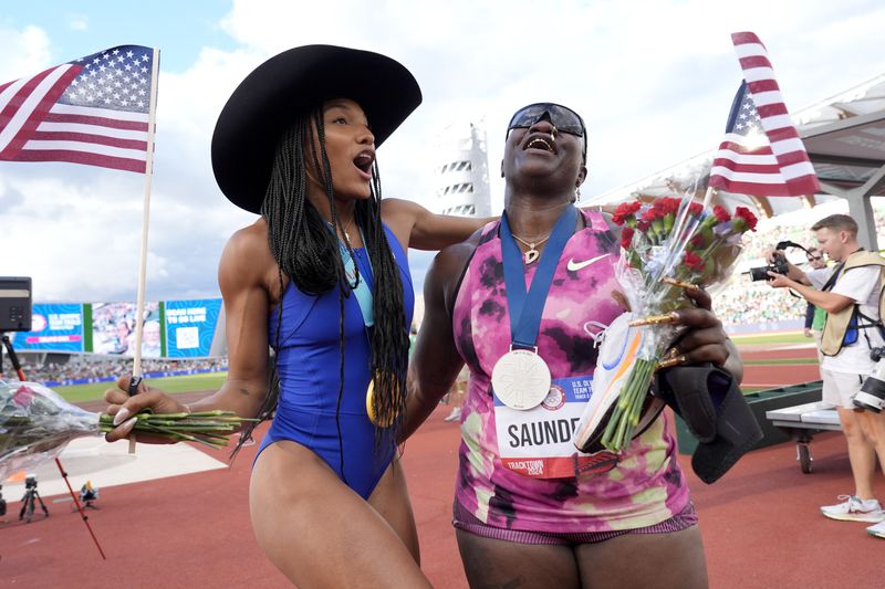 Tara Davis-Woodhall celebrates after winning the women's long jump final with Raven Saunders during the U.S. Track and Field Olympic Team Trials Saturday, June 29, 2024, in Eugene, Ore.(AP Photo/George Walker IV)