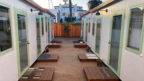 This image courtesy of Dignity Moves shows the tiny homes community in downtown Santa Barbara, Calif., photographed in 2022. Dignity Moves and the County of Santa Barbara partnered on this interim supportive housing community, consisting of 34 private rooms with shared community spaces and access to county services. (Dignity Moves via AP)