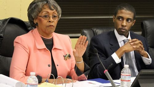 East Point Mayor Earnestine Pittman speaks while councilman Alexander Gothard listens after residents got a chance to express their opinions on the subject of water/sewer rates vs. property tax increase during the city council meeting on Monday Mar. 5, 2012.