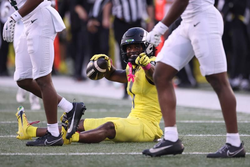 Oregon wide receiver Traeshon Holden (1) reacts after catching a pass during the first half of an NCAA college football game against Michigan State, Friday, Oct. 4, 2024, in Eugene, Ore. (AP Photo/Amanda Loman)