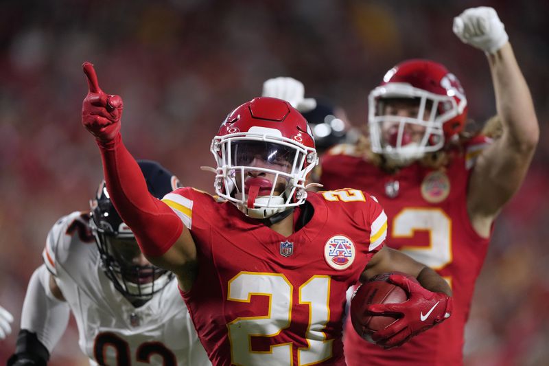 Kansas City Chiefs defensive back Jaden Hicks (21) celebrates after recovering a fumble during the first half of an NFL preseason football game against the Chicago Bears Thursday, Aug. 22, 2024, in Kansas City, Mo. (AP Photo/Charlie Riedel)