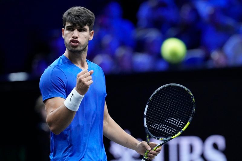 Team Europe's Carlos Alcaraz reacts during his singles tennis match against Team World's Taylor Fritz on the third day of the Laver Cup tennis tournament, at the Uber arena in Berlin, Germany, Sunday, Sept. 22, 2024. (AP Photo/Ebrahim Noroozi)