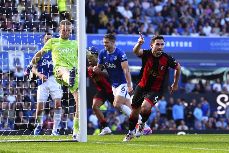 Bournemouth's Lewis Cook, right, celebrates scoring during the English Premier League soccer match between Everton and Bournemouth at Goodison Park, Liverpool, England, Saturday Aug. 31, 2024. (Peter Byrne/PA via AP)