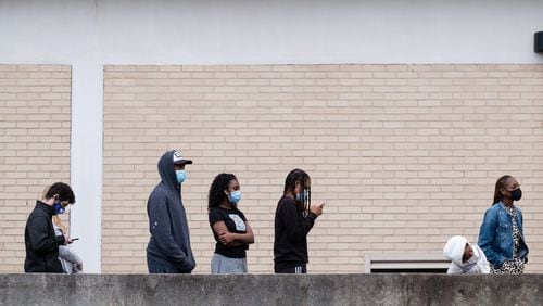 211228-Atlanta-People wait in line for Covid testing at the Fulton County Center for Health and Rehabilitation on Tuesday morning, Dec. 28, 2021. Ben Gray for the Atlanta Journal-Constitution