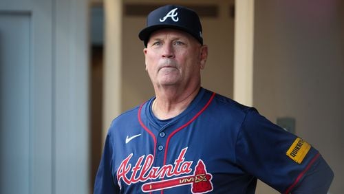 Atlanta Braves manager Brian Snitker (43) watches from the dugout before National League Division Series Wild Card Game Two against the San Diego Padres at Petco Park in San Diego on Wednesday, Oct. 2, 2024.   (Jason Getz / Jason.Getz@ajc.com)