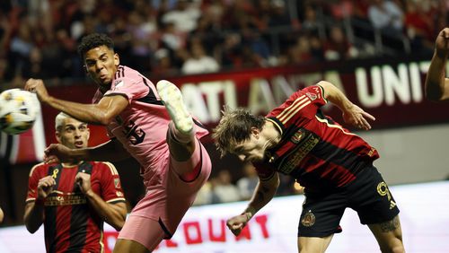 Atlanta United midfielder Saba Lobzhanidze (9) connects the ball with a header to score his team's first goal during the second half of an MLS soccer match against Inter Miami, Wednesday, Sept. 18, 2024, in Atlanta. (Miguel Martinez/Atlanta Journal-Constitution via AP)