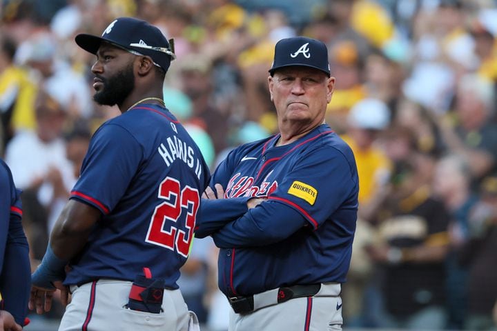 Atlanta Braves outfielder Michael Harris II (23) and Braves manager Brian Snitker participate in player introductions before during the National League Division Series Wild Card Game One at Petco Park in San Diego on Tuesday, Oct. 1, 2024.   (Jason Getz / Jason.Getz@ajc.com)