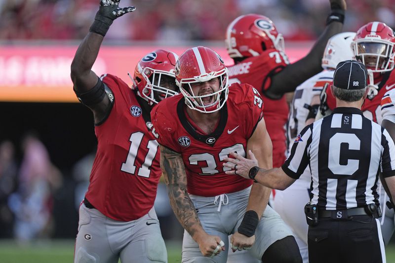 Georgia linebacker Chaz Chambliss (32) reacts after sacking Auburn quarterback Payton Thorne in the second half of an NCAA college football game Saturday, Oct. 5, 2024, in Athens, Ga. (AP Photo/John Bazemore)