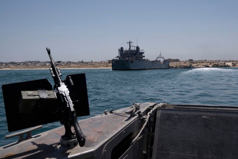 A U.S. Army vessel is seen moored at the U.S.-built floating pier Trident that connects to the beach on the coast of the Gaza Strip, Tuesday, June 25, 2024. (AP Photo/Leo Correa)