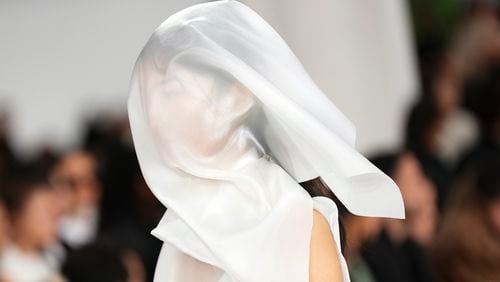 A model wears a creation as part of the Issey Miyake Spring/Summer 2025 collection presented Friday, Sept. 27, 2024 in Paris. (Photo by Scott A Garfitt/Invision/AP)