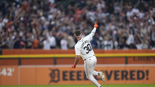 Detroit Tigers' Kerry Carpenter celebrates his grand slam against the Chicago White Sox in the fifth inning of a baseball game, Sunday, Sept. 29, 2024, in Detroit. (AP Photo/Paul Sancya)