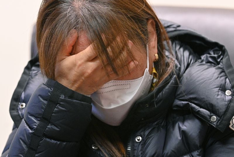 Hyun Jung Kim, 48, daughter of one of Atlanta spas shooting victims, Soon Chung Park, cries as she and her younger sister Hyo Jung Kim, 46, recall their late mother on Friday, April 2, 2021. Soon Chung Park was among eight people shot and killed March 16 at three spas, two in Atlanta and one in Cherokee County. Park was one of six female victims of Asian heritage. (Hyosub Shin / Hyosub.Shin@ajc.com)