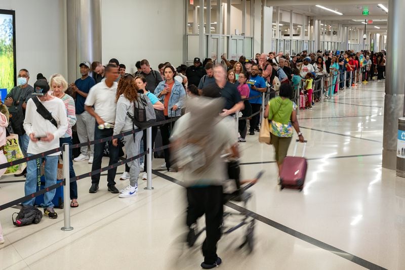 Traveler's wait in long lines Monday morning at Hartsfield-Jackson International Airport following July 4th weekend. Monday, July 8th, 2024 (Ben Hendren for the Atlanta Journal-Constitution)