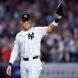 Aaron Judge waves to fans after the New York Yankees clinched the American League East title, Thursday, Sept. 26, 2024, in New York. (AP Photo/Noah K. Murray)