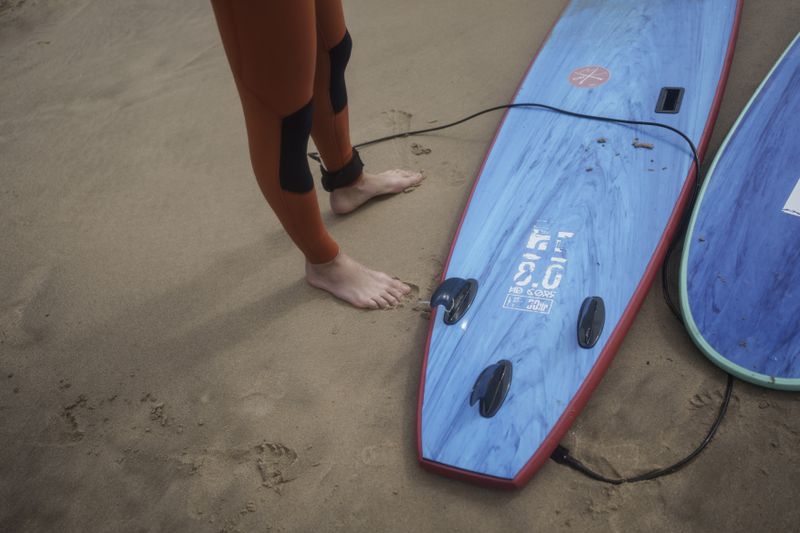 Surf Church pastor, the Rev. Samuel Cianelli, gets ready to surf with members of his congregation in Matosinhos beach in the suburbs of Porto, Portugal on Sunday, Aug. 18, 2024. (AP Photo/Luis Andres Henao)