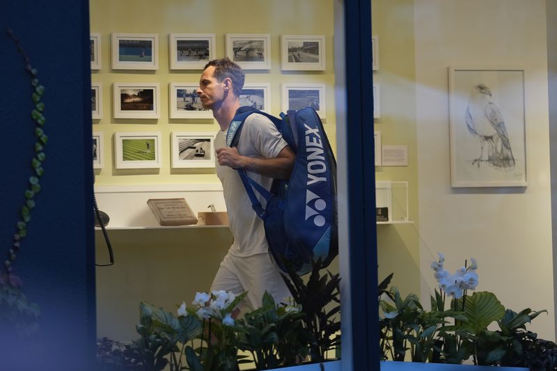 Britain's Andy Murray walks through the players change room as he leaves Center Court following his first round doubles loss at the Wimbledon tennis championships in London, Thursday, July 4, 2024.(AP Photo/Alberto Pezzali)