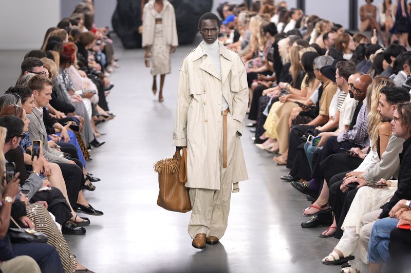 A model walks the runway during the Michael Kors Collection spring/summer 2025 fashion show as part of New York Fashion Week, Tuesday, Sept. 10, 2024, in New York. (AP Photo/Pamela Smith)