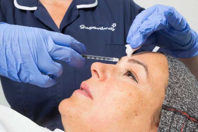 A patient receives a treatment that will include anti-wrinkle and skin rejuvenation aesthetic treatments such as BOTOX and Juvederm dermal fillers. AP File Photo.