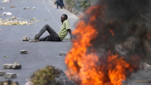 FILE - Protesters block the busy Nairobi - Mombasa highway in the Mlolongo area, Nairobi, Kenya, July 2, 2024. (AP Photo/Brian Inganga, file)