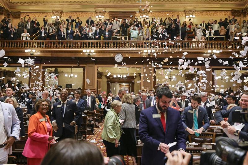 House members throw up paper at the conclusion of the legislative session in the House Chamber on Sine Die, the last day of the General Assembly at the Georgia State Capitol in Atlanta on Wednesday, March 29, 2023. (Natrice Miller/The Atlanta Journal-Constitution)