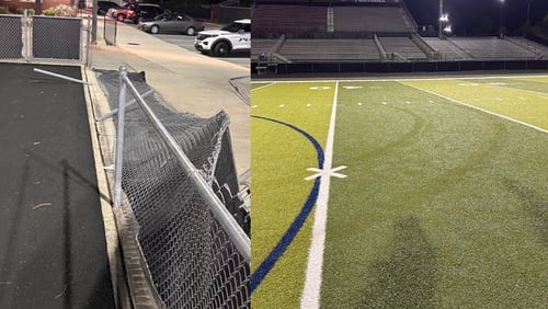 Two teenagers were arrested Tuesday after a truck knocked over a gate and some fencing before doing doughnuts on the football field at Mill Creek High School, officials said.