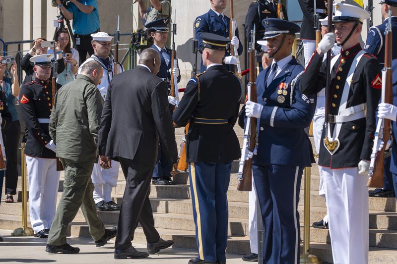 Ukraine's Defense Minister Rustem Umerov, walks at left, with Defense Secretary Lloyd Austin, during an arrival ceremony at the Pentagon, Tuesday, July 2, 2024, in Washington. (AP Photo/Jacquelyn Martin)