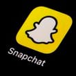 FILE - The icon for Snapchat is seen on a smartphone, Feb. 28, 2023, in Marple Township, Pa. (AP Photo/Matt Slocum, File)