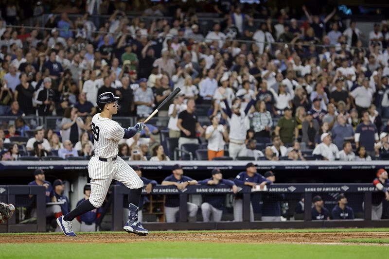 New York Yankees' Aaron Judge hits a grand slam during the seventh inning of a baseball game at bat Friday, Sept. 13, 2024, in New York. (AP Photo/Adam Hunger)