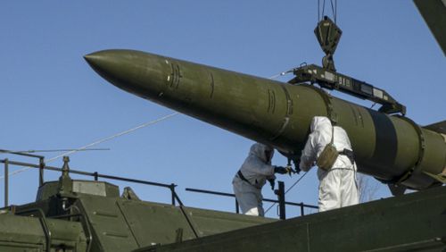 FILE - In this photo released by the Russian Defense Ministry Press Service on Feb. 2, 2024, Russian troops load an Iskander missile onto a mobile launcher during drills at an undisclosed location in Russia. Hawks in Russia have called for revising the country's nuclear doctrine to lower the threshold for using nuclear weapons, and President Vladimir Putin said the doctrine could be modified. (Russian Defense Ministry Press Service via AP, File)