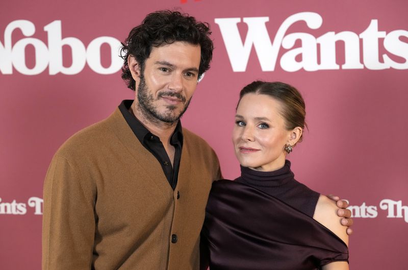 FILE - Adam Brody, left, and Kristen Bell, cast members in "Nobody Wants This," pose together at a photo call for the Netflix series at The Aster hotel, Wednesday, Sept. 18, 2024, in Los Angeles. (AP Photo/Chris Pizzello, File)