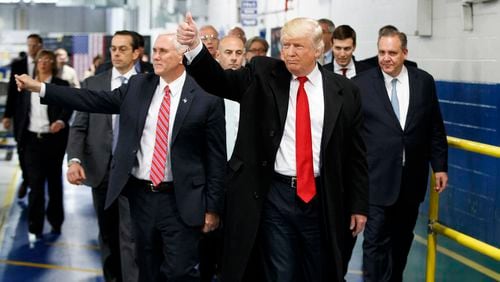 President-elect Donald Trump and Vice President-elect Mike Pence wave as they visit to Carrier factory, Thursday, Dec. 1, 2016, in Indianapolis, Ind. (AP Photo/Evan Vucci)