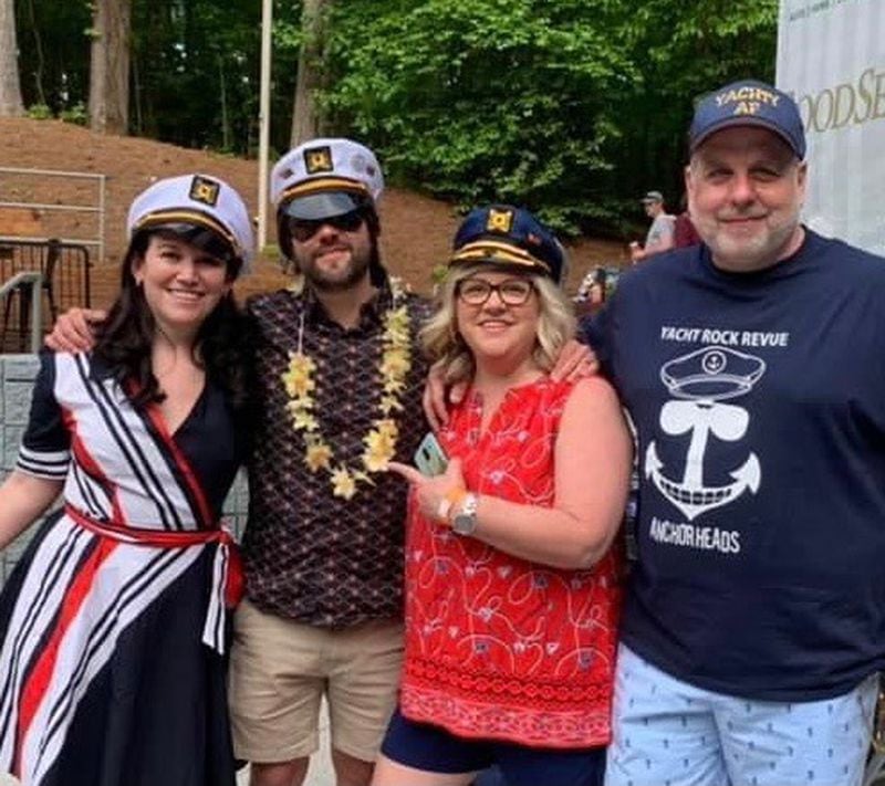 Founders of the Yacht Rock Revue fan club the Anchorheads at an April 2021 concert at Frederick Brown Amphitheatre in Peachtree City include, from left, Ella Leitner from New York City, Will Fisher from Knoxville, Tennessee. and Michelle and Cody Painter from Burlington, Kentucky. CONTRIBUTED