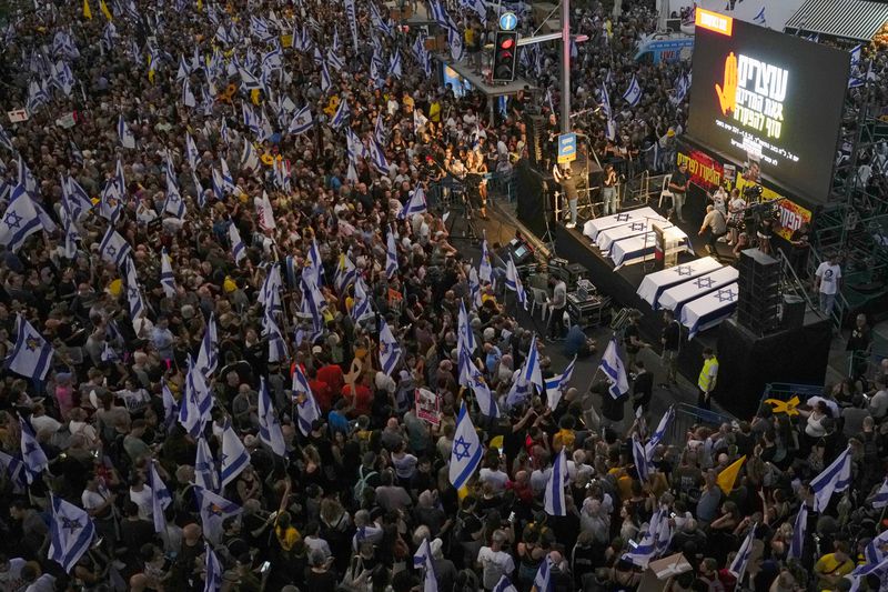 People take part in a protest calling for a deal for immediate release of hostages held in the Gaza Strip by the Hamas militant group, in Tel Aviv, Sunday, Sept. 1, 2024. (AP Photo/Ariel Schalit)