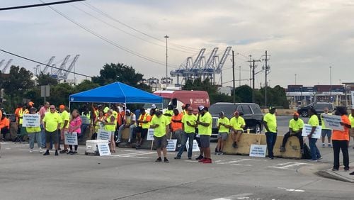 Union dockworkers picket at the main gate at the Georgia Ports Authority's Garden City Terminal in Savannah on Tuesday, Oct. 1, 2024 as part of the International Longshoremen's Association strike. (Adam Van Brimmer/AJC)