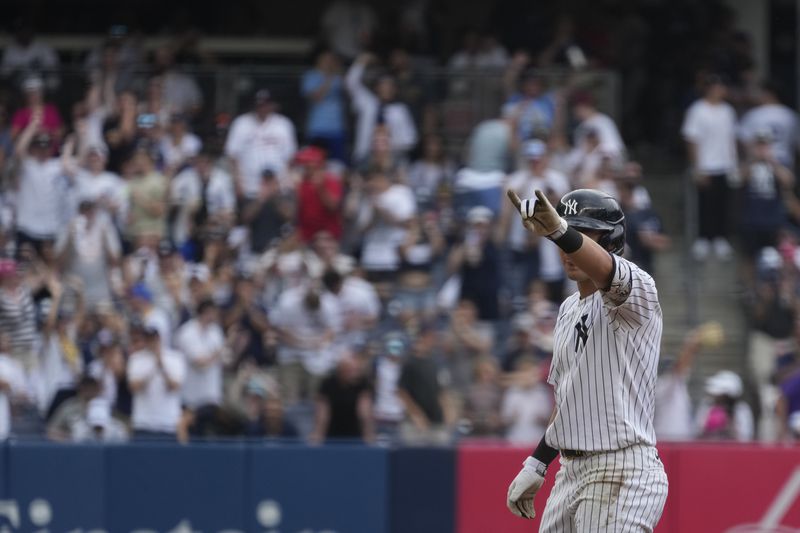 New York Yankees' Anthony Volpe celebrates hitting a double leading to Trent Grisham scoring during the sixth inning of a baseball game against the Atlanta Braves, Sunday, June 23, 2024, in New York. (AP Photo/Pamela Smith)