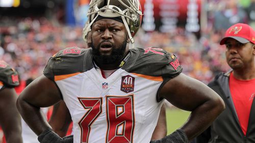 FILE - Tampa Bay Buccaneers tackle Gosder Cherilus (78) walks of the field at halftime during the first half of an NFL football game against the Washington Redskins in Landover, Md., Oct. 25, 2015. (AP Photo/Mark Tenally, file)