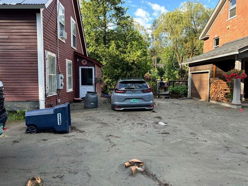 An SUV sits in flood debris in Plainfield, Vermont, Thursday, July 11, 2024. (AP Photo/Lisa Rathke)